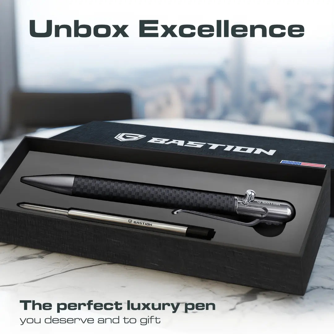  Carbon Fiber and Stainless Steel - Slim Bolt Action Pen by Bastion in box, showing the pen, ink cartridge, and branding