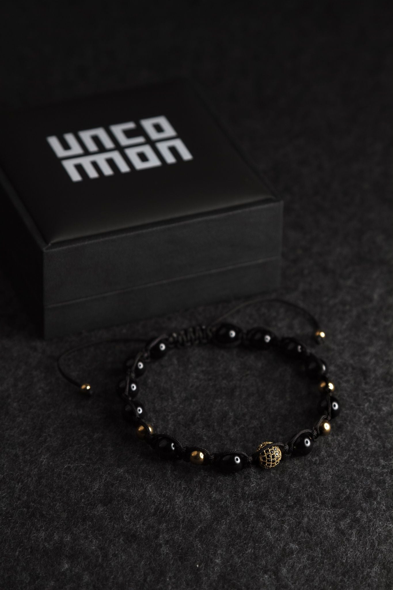 UNCOMMON Men's Beads Bracelet One Gold Jeweled Globe Charm Black Onyx Beads