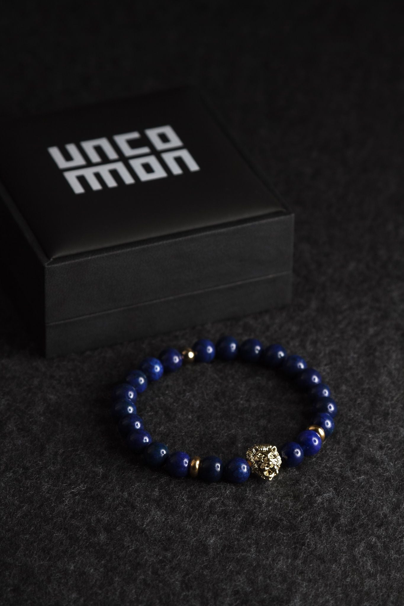 UNCOMMON Men's Beads Bracelet One Gold Lion Charm Blue Jasper Beads